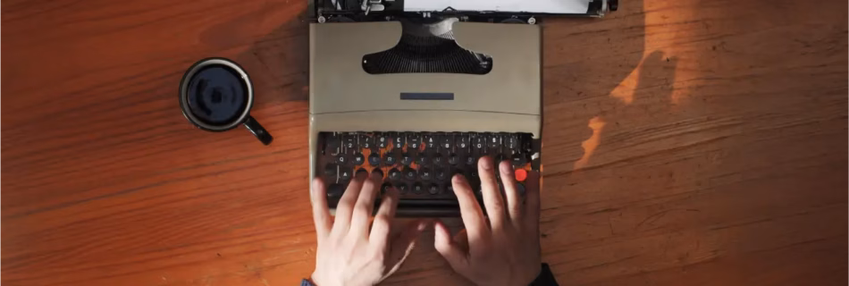 writing a video script with a vintage typewriter